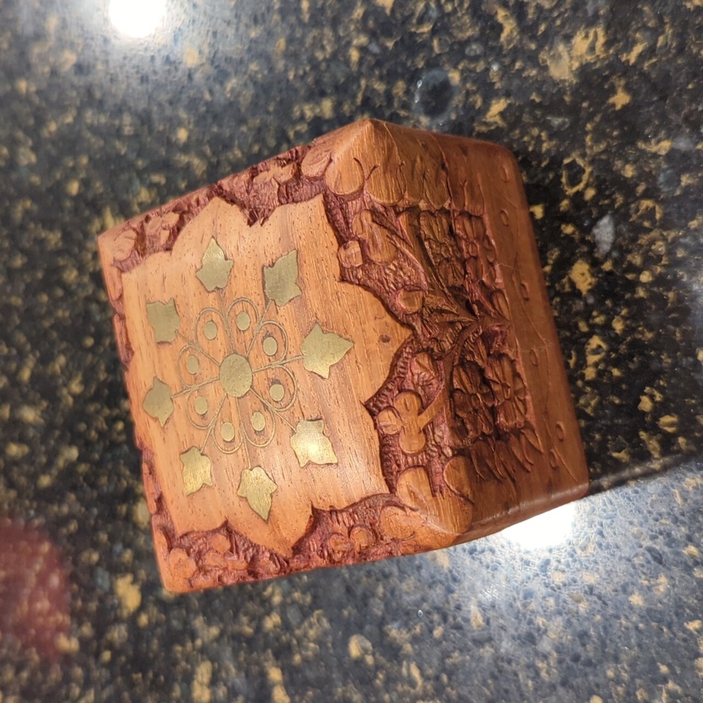 Carved box with brass inlay